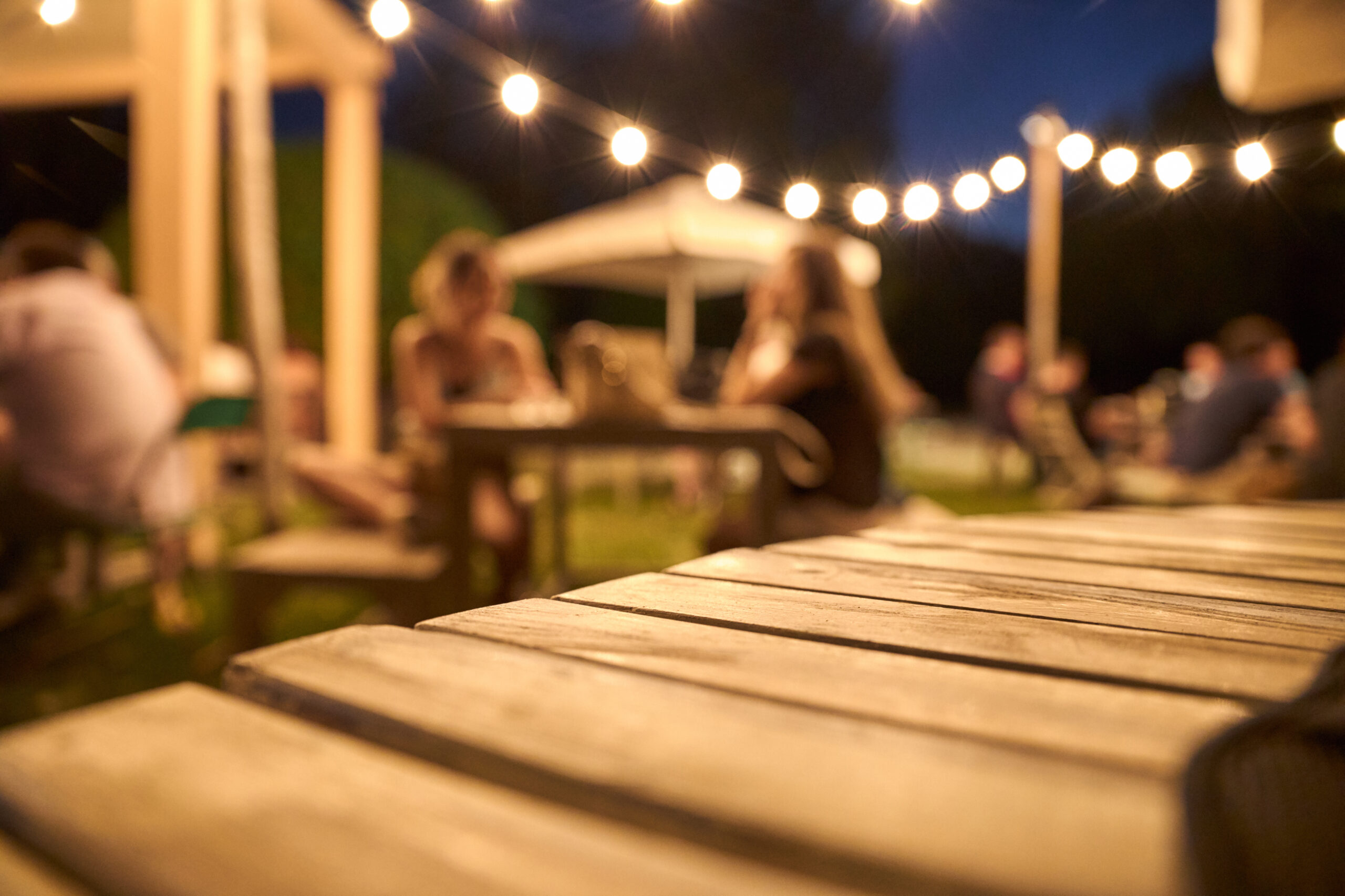 view of a wooden table on the terrace of a bar